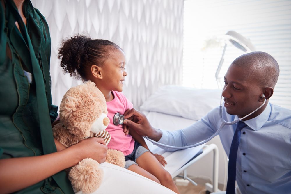 doctor and pediatric patient at well child visit