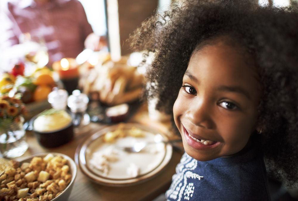 Child eating at the table.