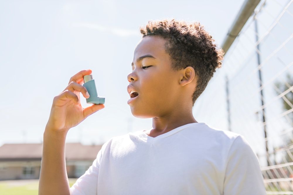 child with an inhaler