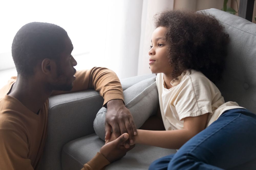 father holding daughters hand.