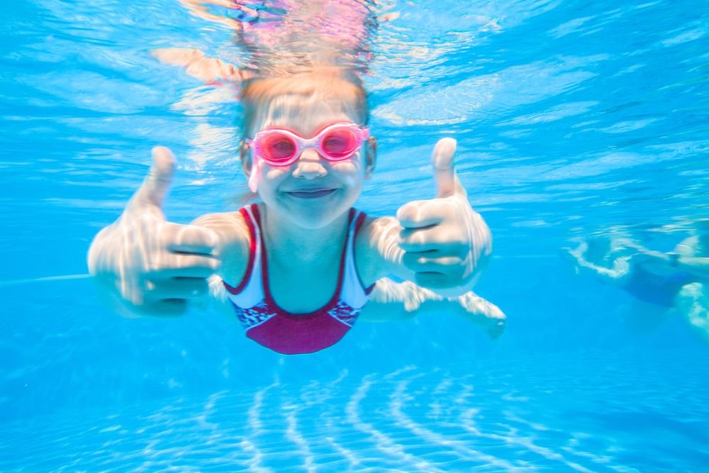 little girl swimming.